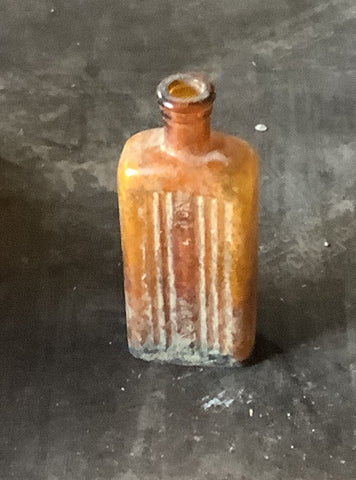 1930s-style men's glass cologne bottle, in an aged condition Film TV Props London