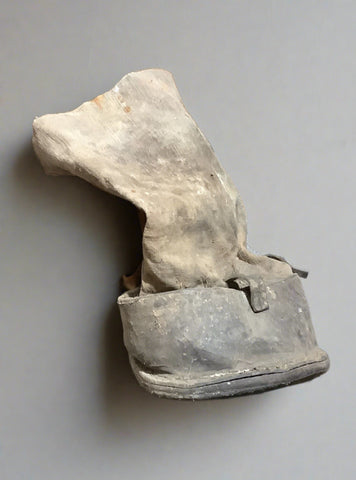 Protective fabric horse boot, in an aged condition.