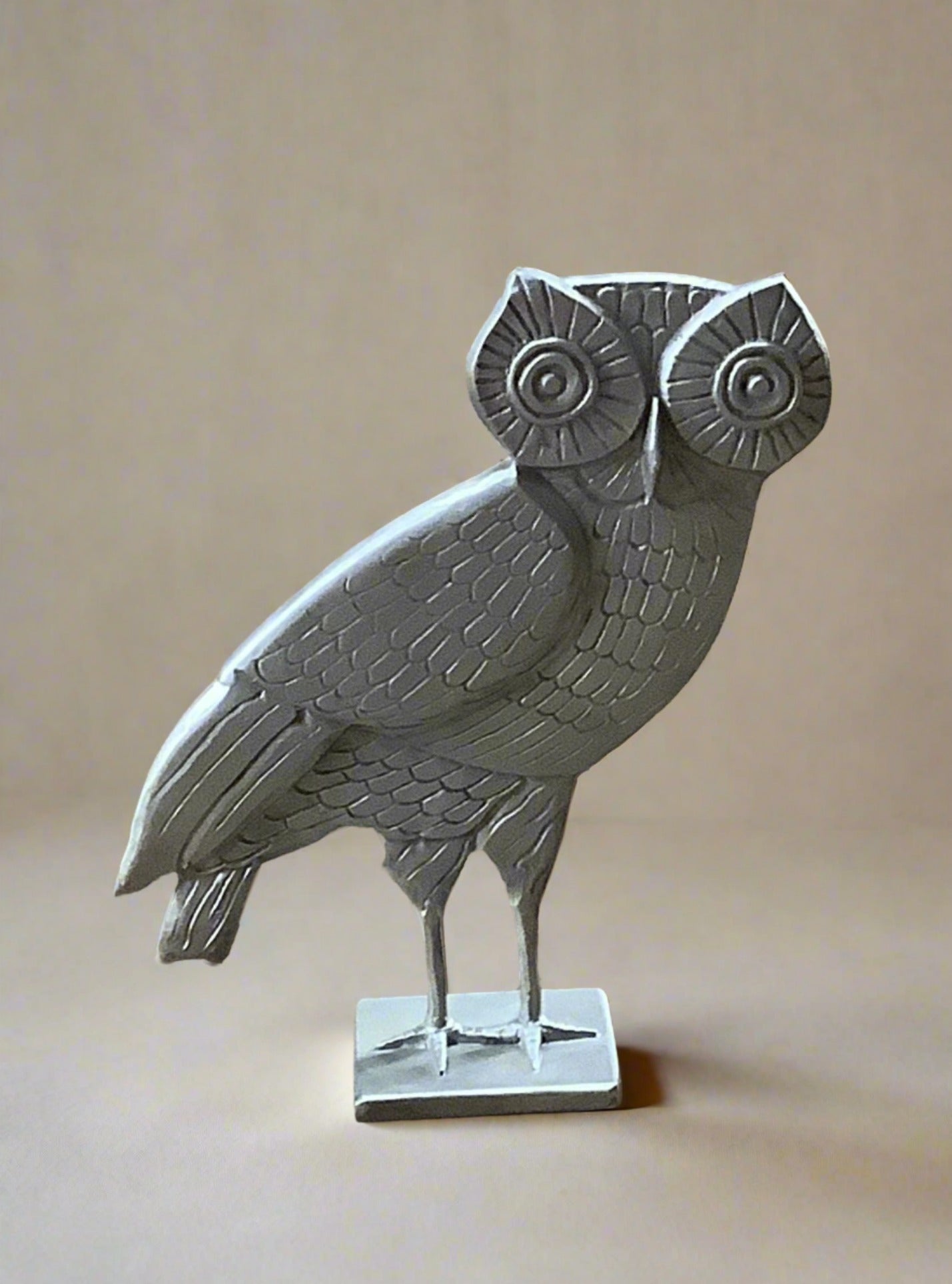 Contemporary standing metal owl statuette.