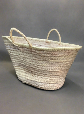Plaited straw shopping bag with woven double handles.
