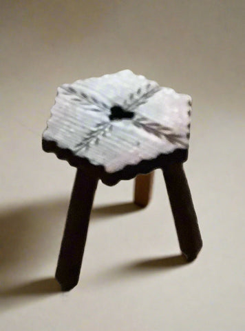 Small wooden child's stool with crimped edges and a heart centre.