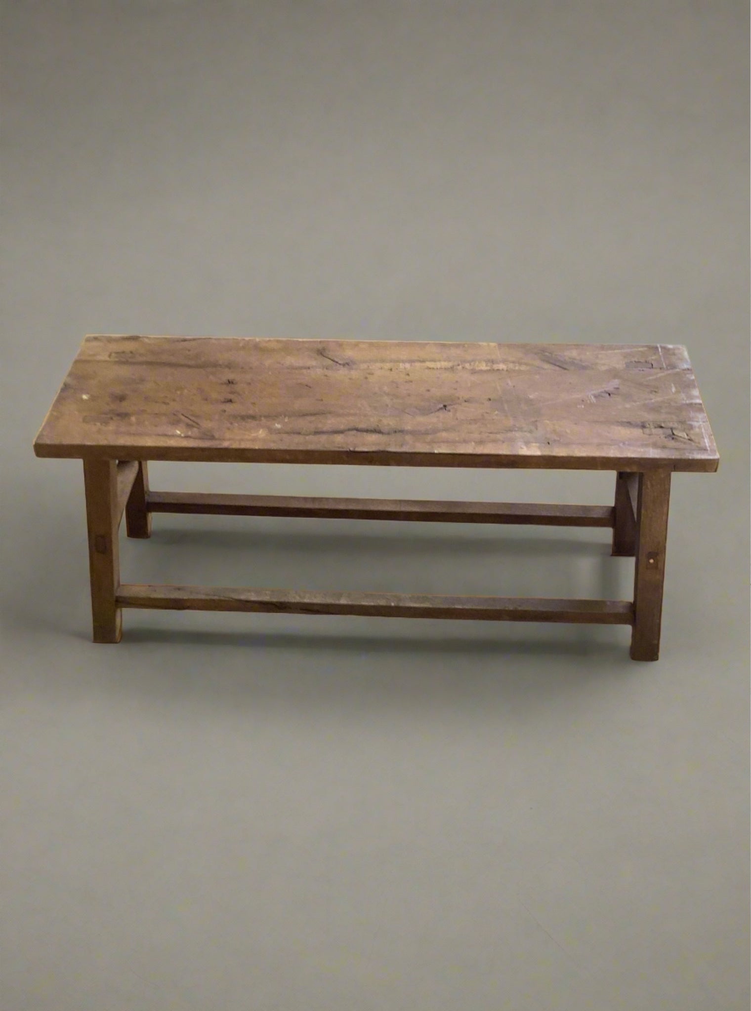 A set of small rustic wooden benches.