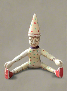 Hand-carved and hand-painted wooden clown doll. European style, reminiscent of Schoenhut circus. Likely pre-1940.