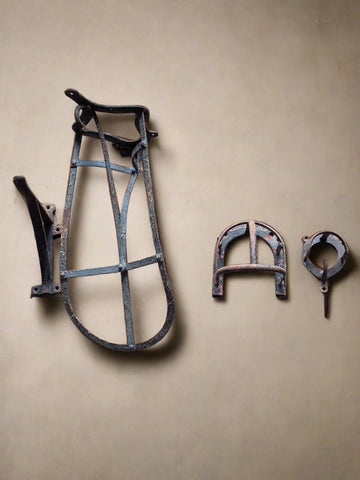 Antique metal saddle and bridle racks.