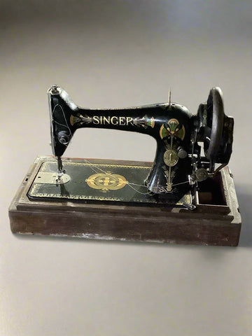 Vintage Singer sewing machine handpainted with a Scandinavian-style floral pattern.