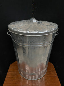 Shiny galvanised steel outdoor dustbin.