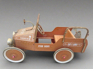 Kid's vintage pedal car fire engine with an orange metal frame.&nbsp;