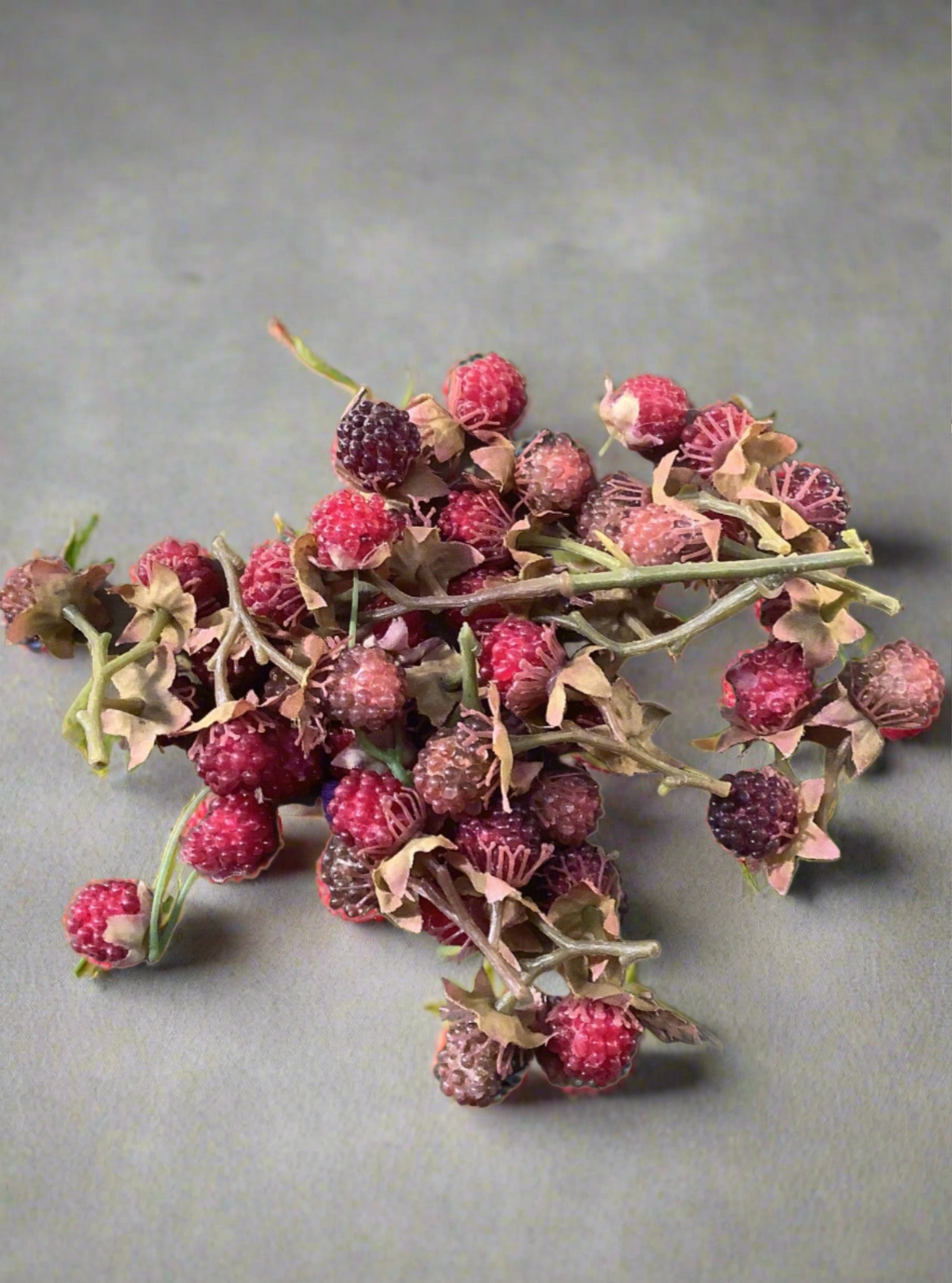 A small bag of faux semi-ripe blackberries.