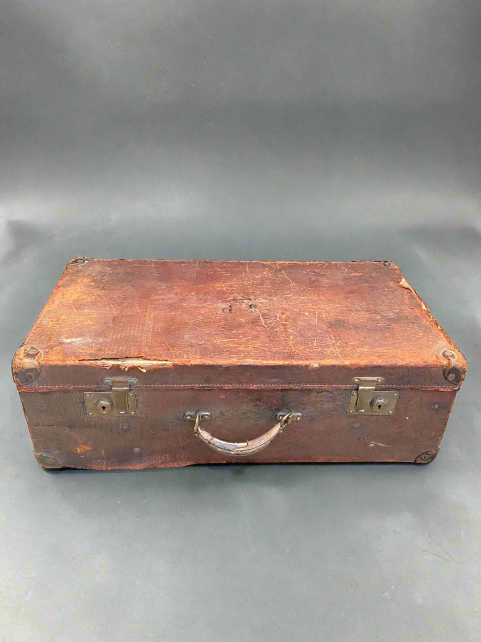 Brown leather JP Initialled Suitcase with brass hardware.