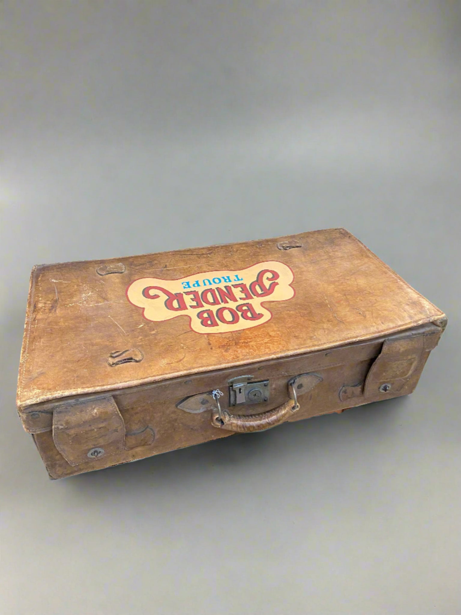 Bob Pender Troupe Leather Suitcase.  Bob Pender was famous as a Drury Lane clown. His wife Margaret was a dancer and reputed to have been a ballet mistress at the Follies Bergere. The group did mime, dancing, tumbling, and stilt walking.