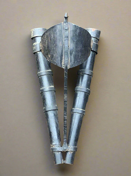 Metal wall-mounted double torch holder.
