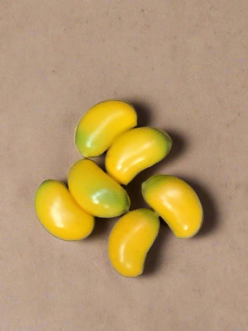 A handful of small plastic yellow beans.