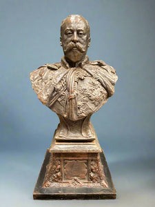 Cast bronze bust statue of Kind Edward VII, sitting on a plinth.