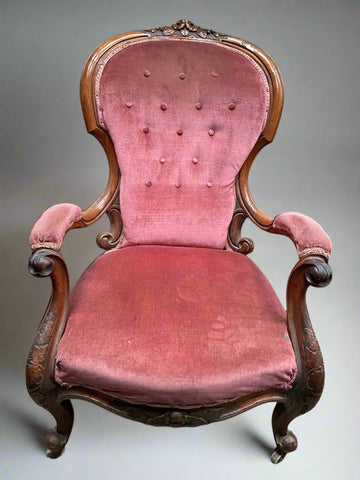 Antique pink fairytale-style armchair with a shallow buttoned effect back. The cabriole legs are carved with what looks like oak leaves.