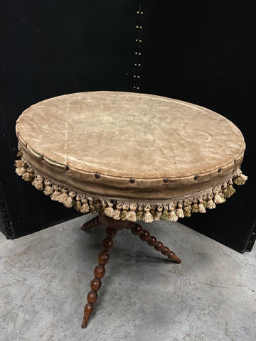 Wooden Table with Tasselled Fabric Cover