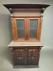 Antique French dresser decorated with carved animal heads and art deco style panelling.