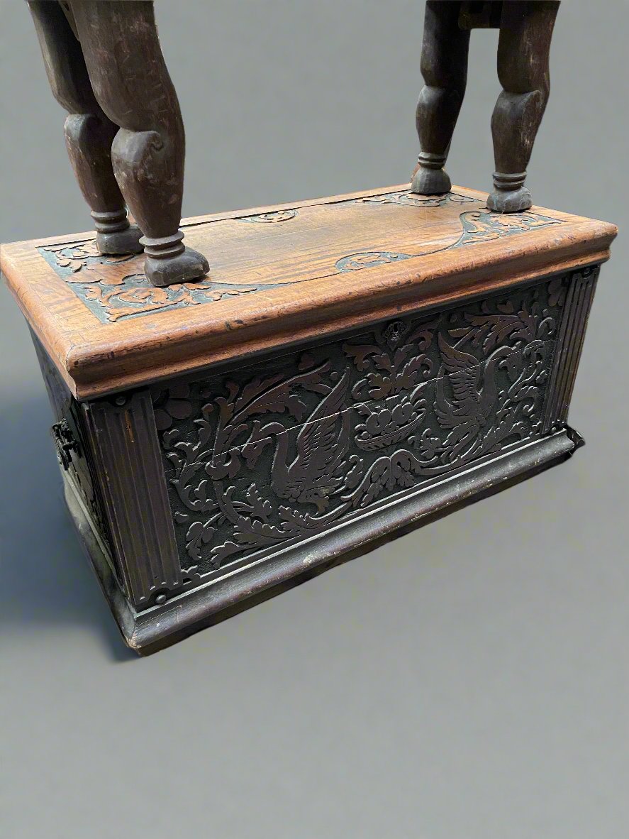 Two-tone wooden storage box with symmetrical carved swans and foliage.