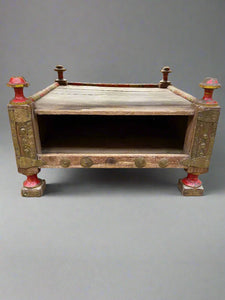 Small Eastern red and gold wooden magazine storage units with four red finials.