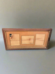 Horizontal wooden picture frame with space for two portrait and one landscape image.