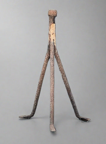 Antique metal blacksmiths' tripod to rest a horse's foot on when shoeing.