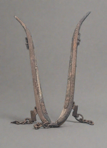 Pair of antique horse haims that go on a collar that goes round the horse's neck, so that they can then be attached to a cart with chain.