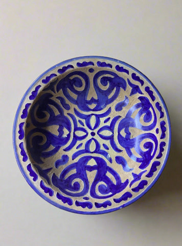 Arabic style bowl in a blue and white glazed geometric pattern.