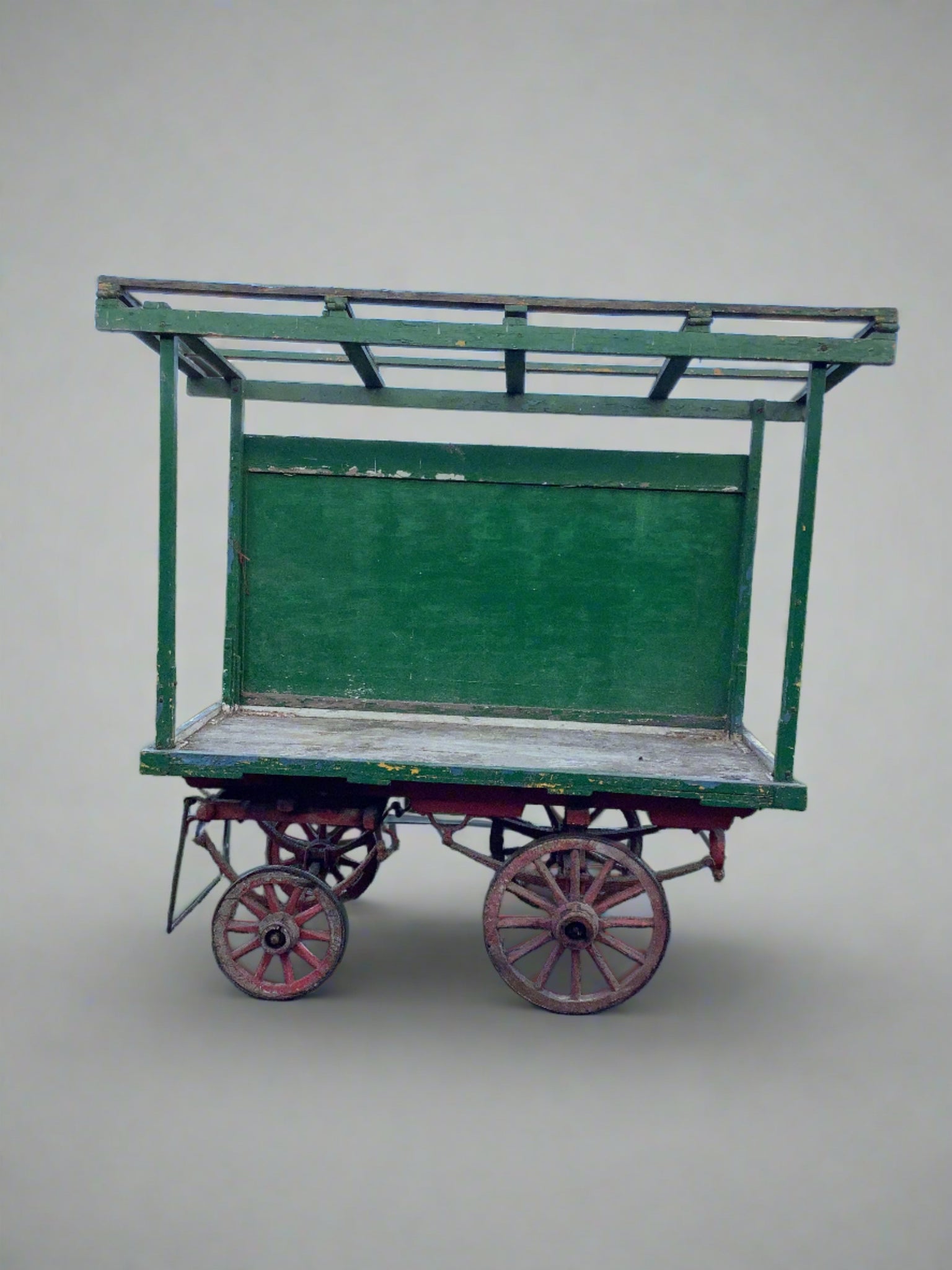 Colourful green wooden market cart with roof.  Textile covering could be added to top section for additional colour if required (hirer to ensure no damage made to cart.)