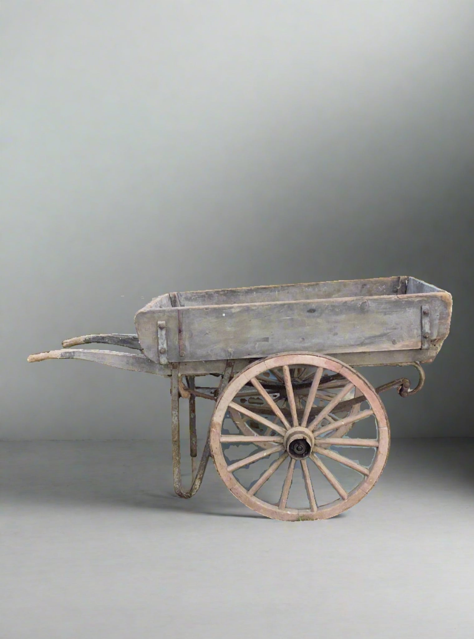 Small and sturdy unpainted wooden market trader's hand cart with metal detailing.