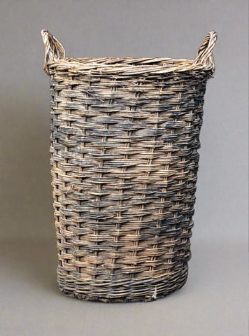 Tall wicker log/laundry basket.