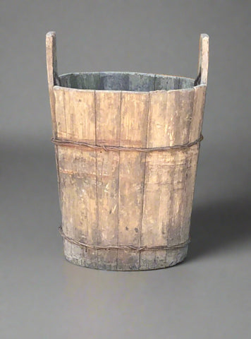 Wooden milk pail with side handles.