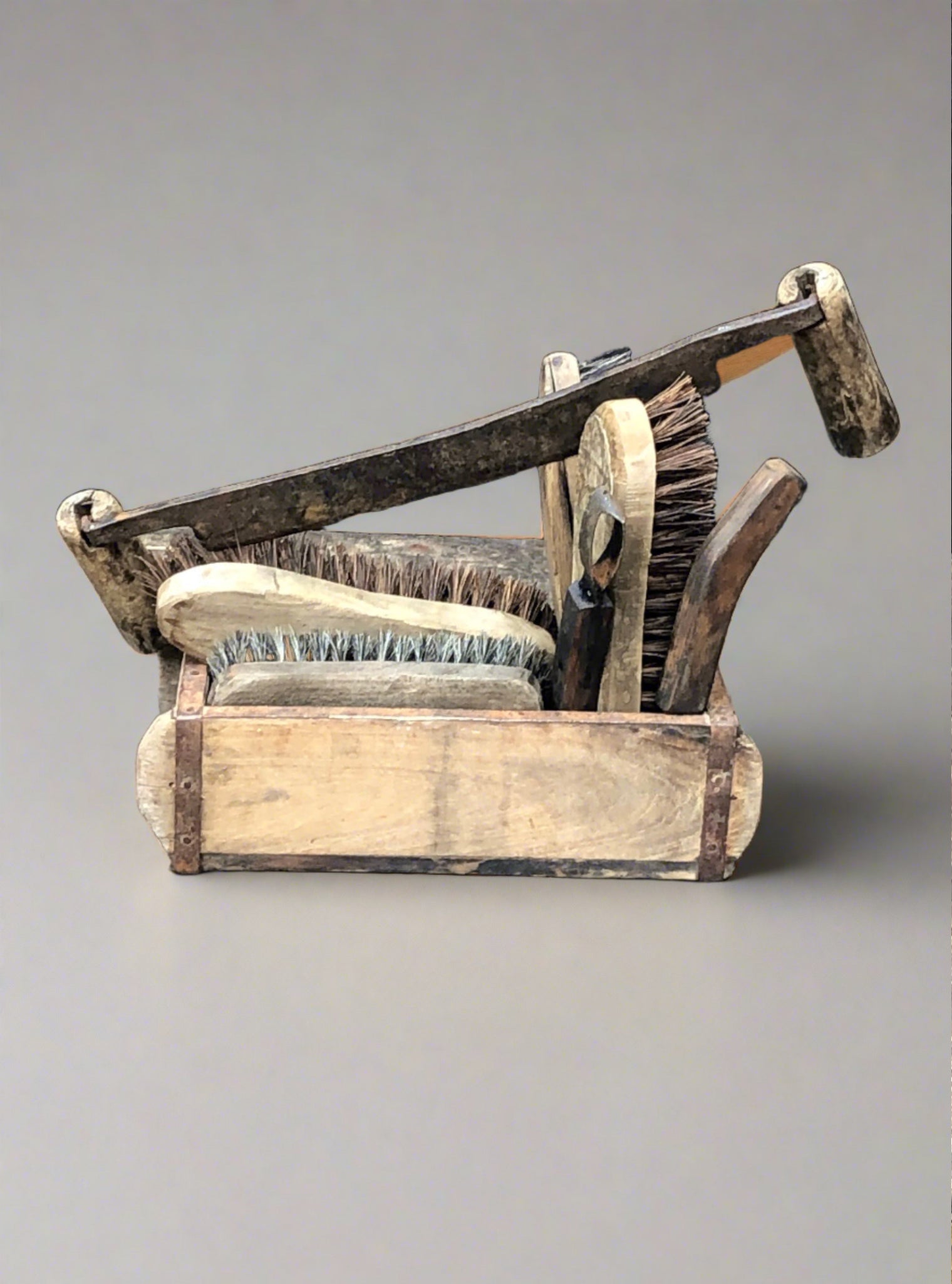 Antique wooden box&nbsp;containing brushes and kit to groom a horse.