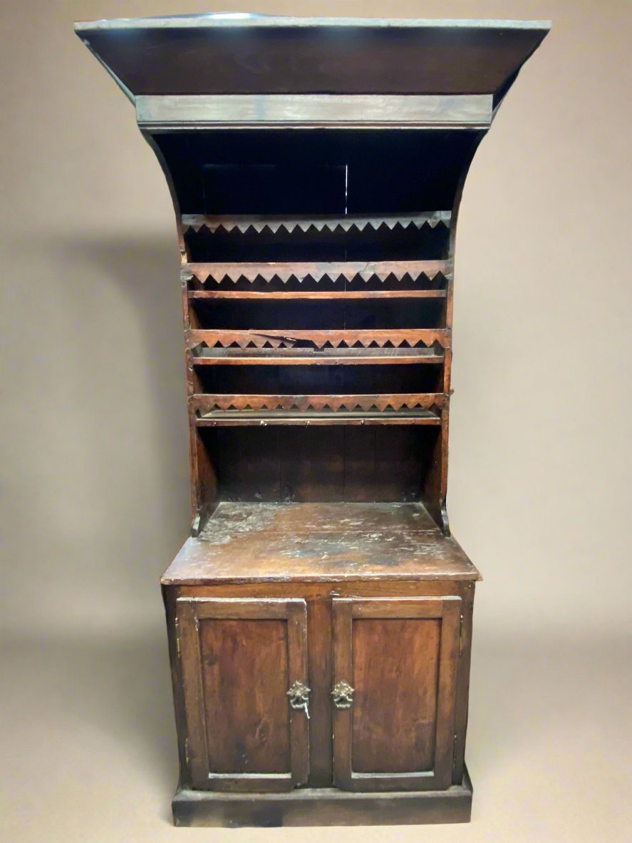 Wooden kitchen dresser with a large wooden canopy and zig-zag detailed fronting.