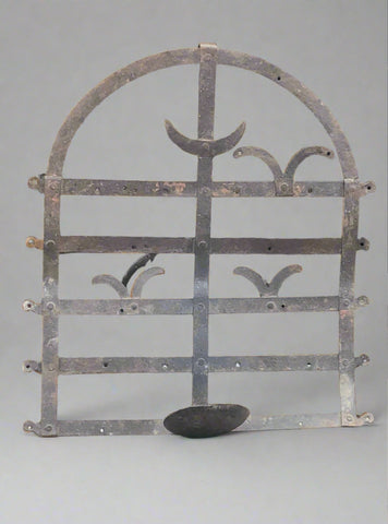 Decorative Metal candle holder with varying detail.